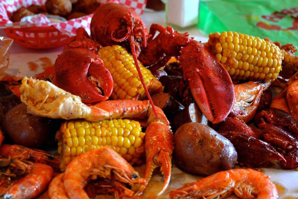Cajun seafood boil with crab legs, corn, and shrimp served at Angry Crab Shack restaurant